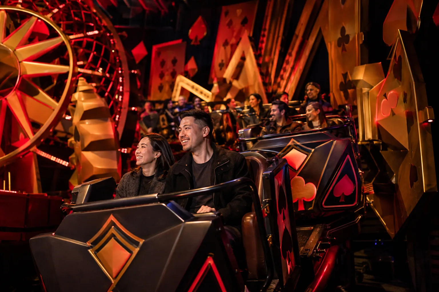 Guests enjoying an immersive card-themed ride